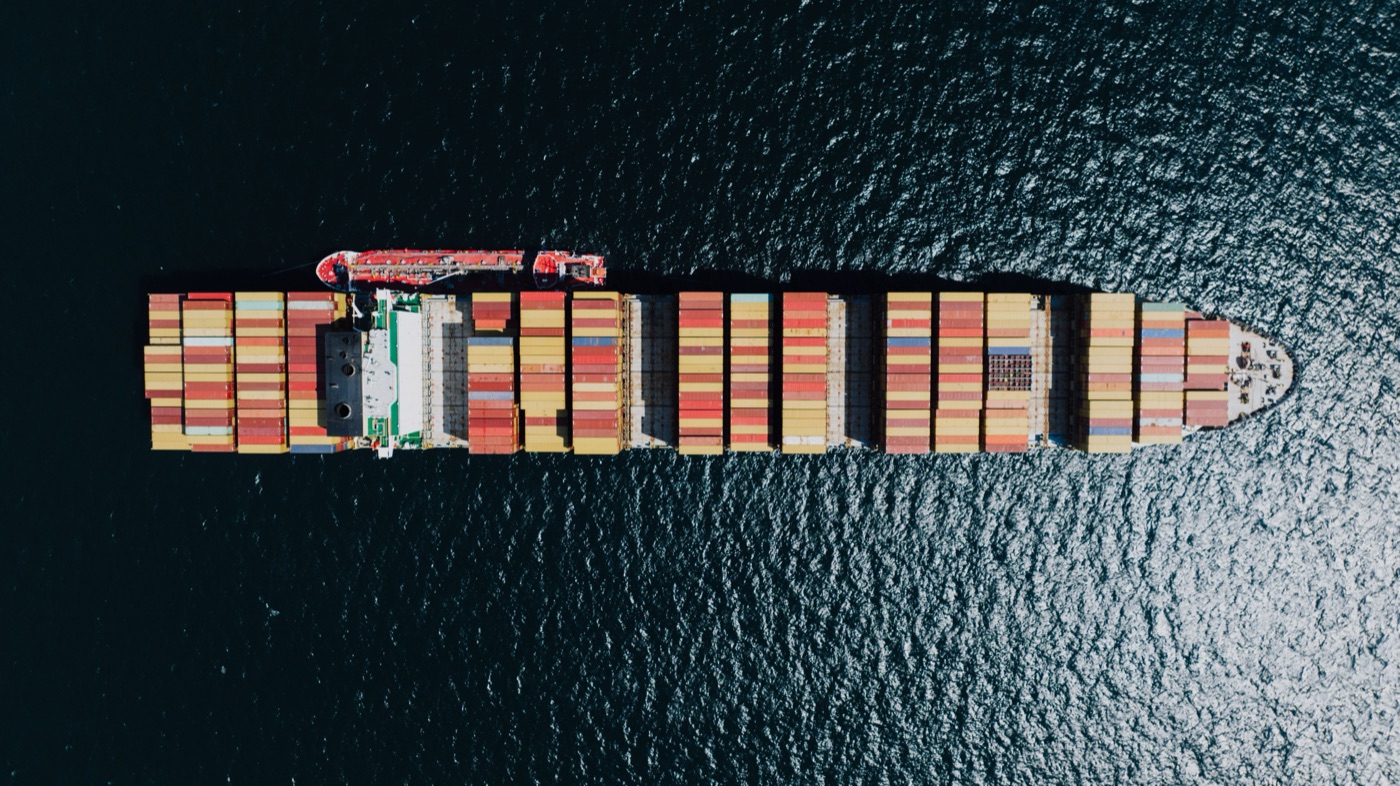 Container ship loaded with cargo at port